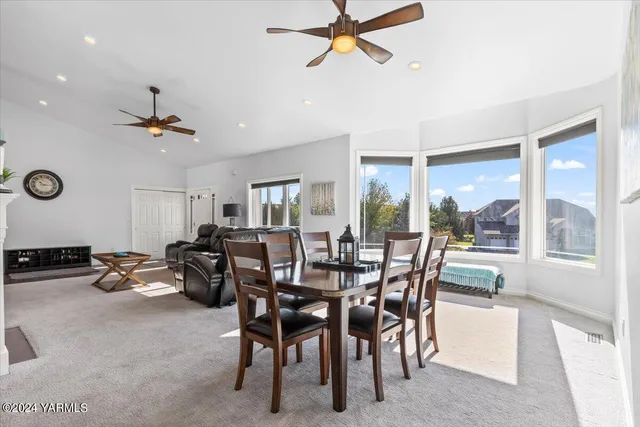 a view of a dining room with furniture window and outside view