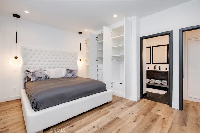 a bedroom with a bed and a closet