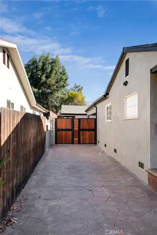 a big room with wooden floor and fence