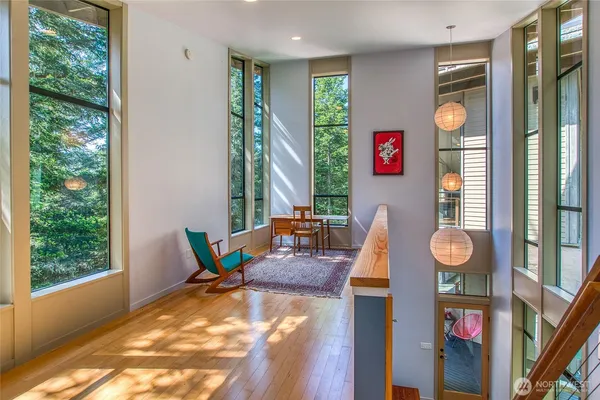 a living room with furniture and large window