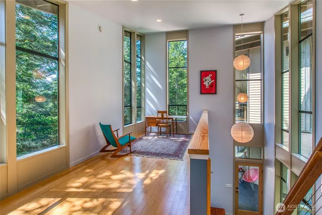 a living room with furniture and large window