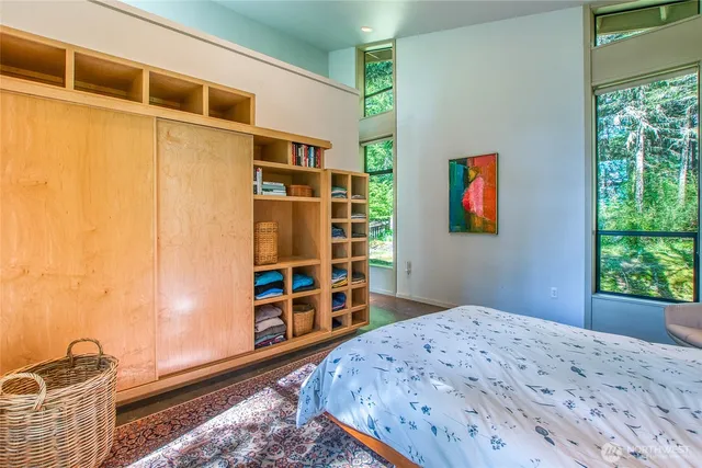 a bedroom with a bed and a window