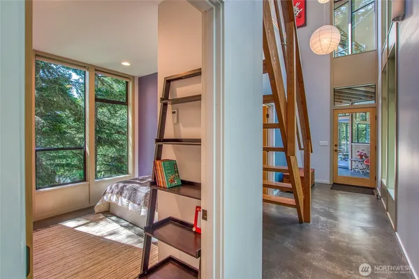 a room with furniture and a large window