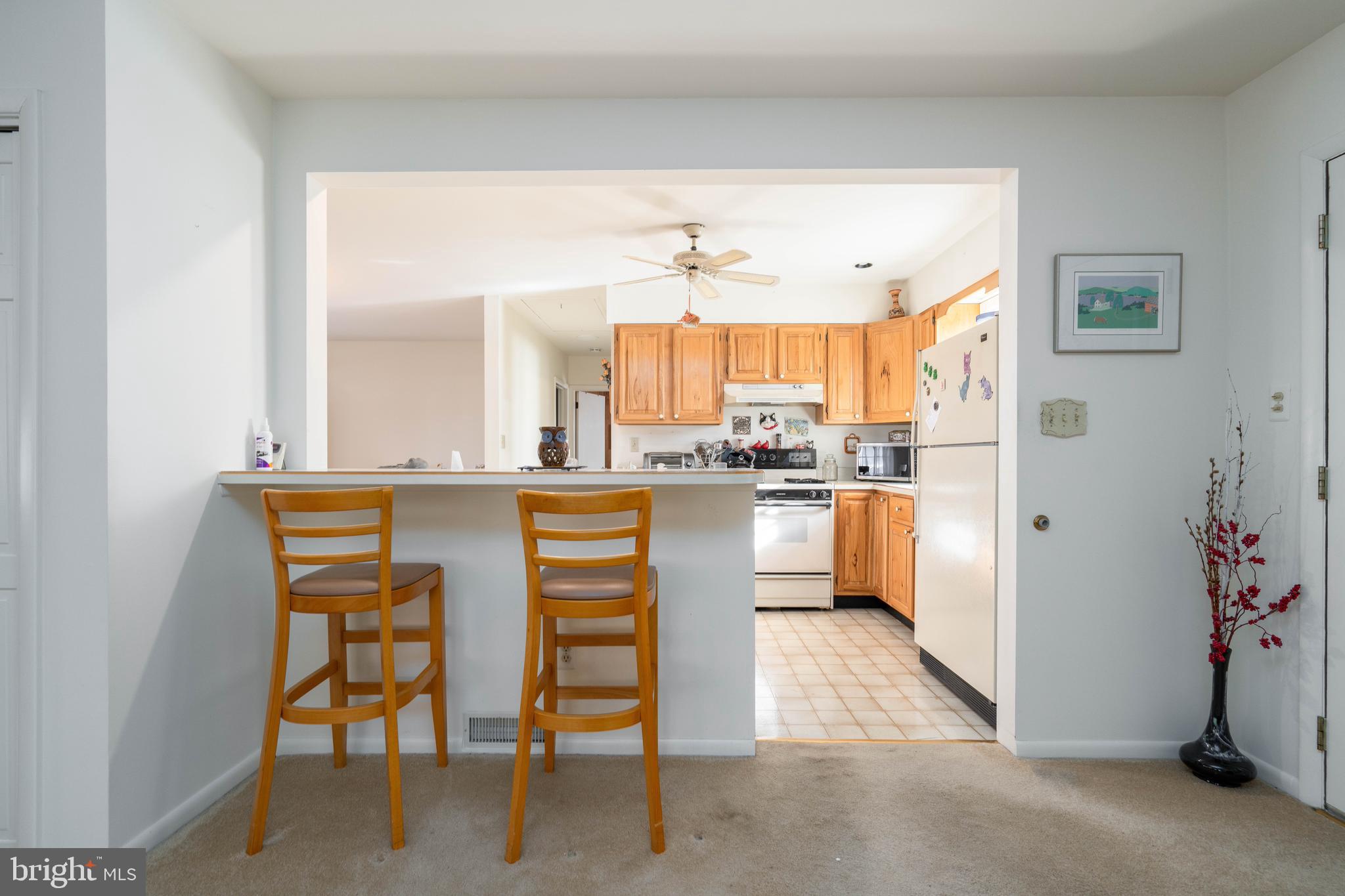 701 Uranus Road Millville, NJ 08332 - Photo 11 of 29 a kitchen with stainless steel appliances kitchen island granite countertop a refrigerator and a sink
