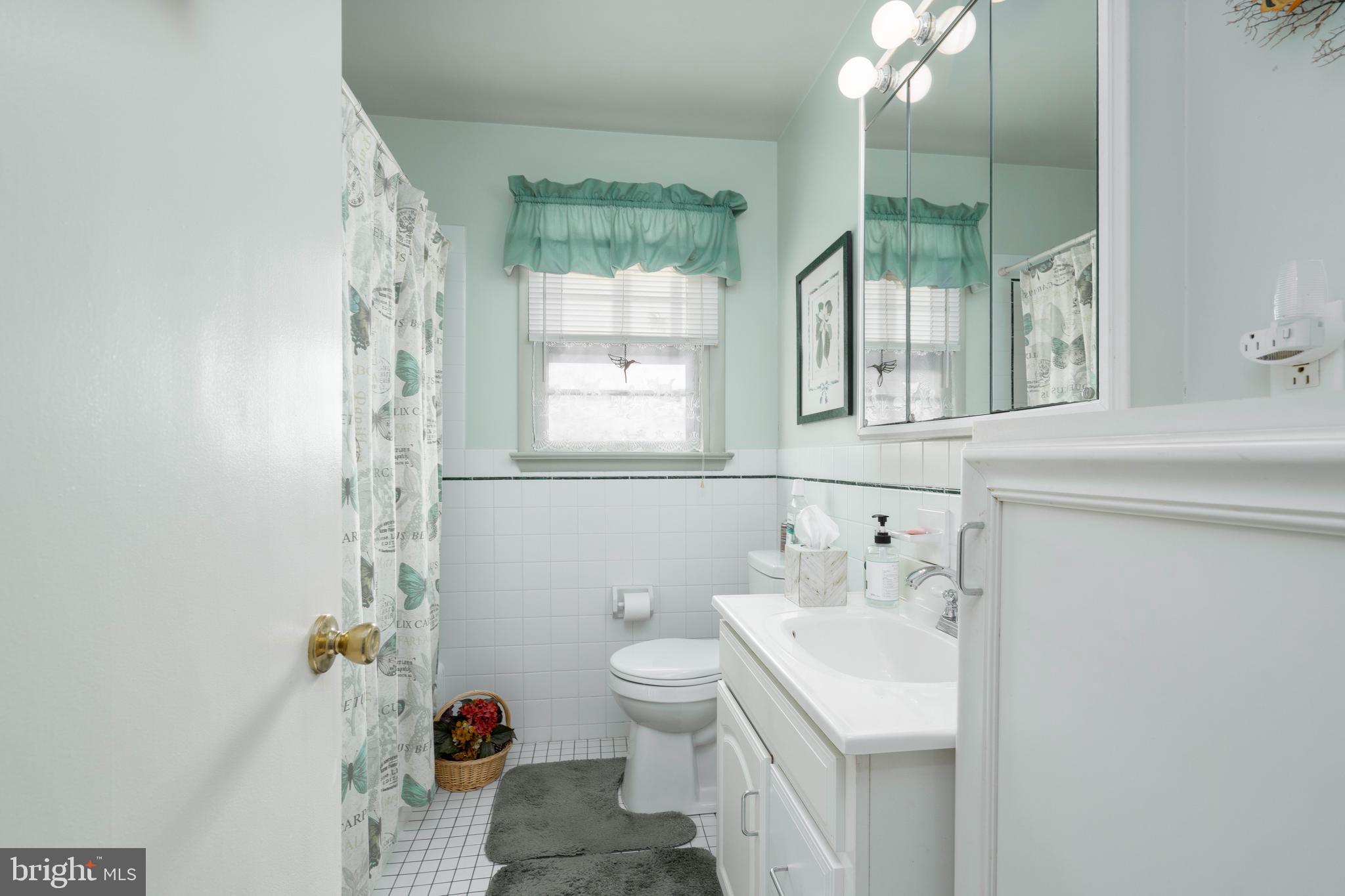 701 Uranus Road Millville, NJ 08332 - Photo 13 of 29 a bathroom with a sink toilet and shower