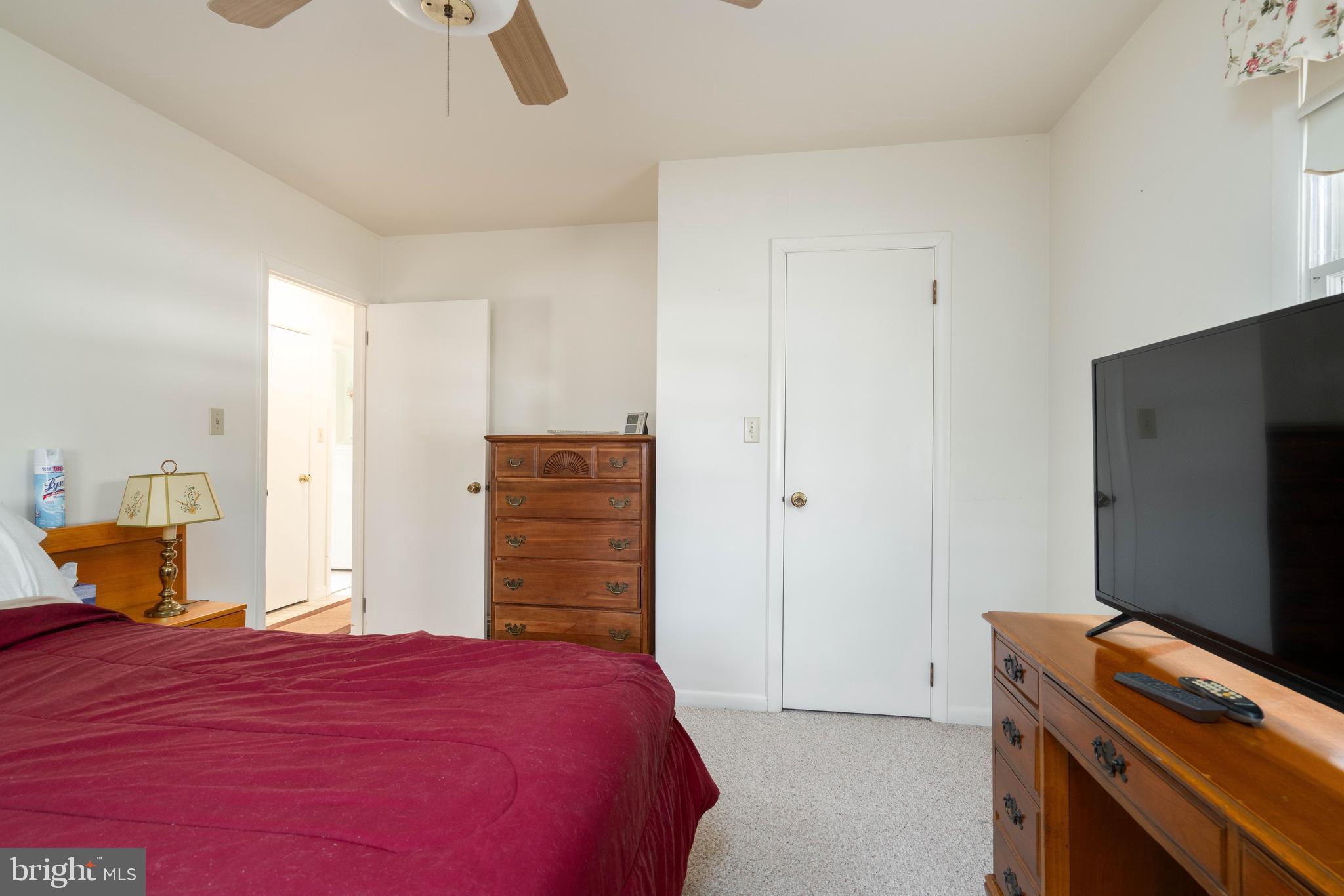 701 Uranus Road Millville, NJ 08332 - Photo 18 of 29 a bedroom with a bed and a flat screen tv