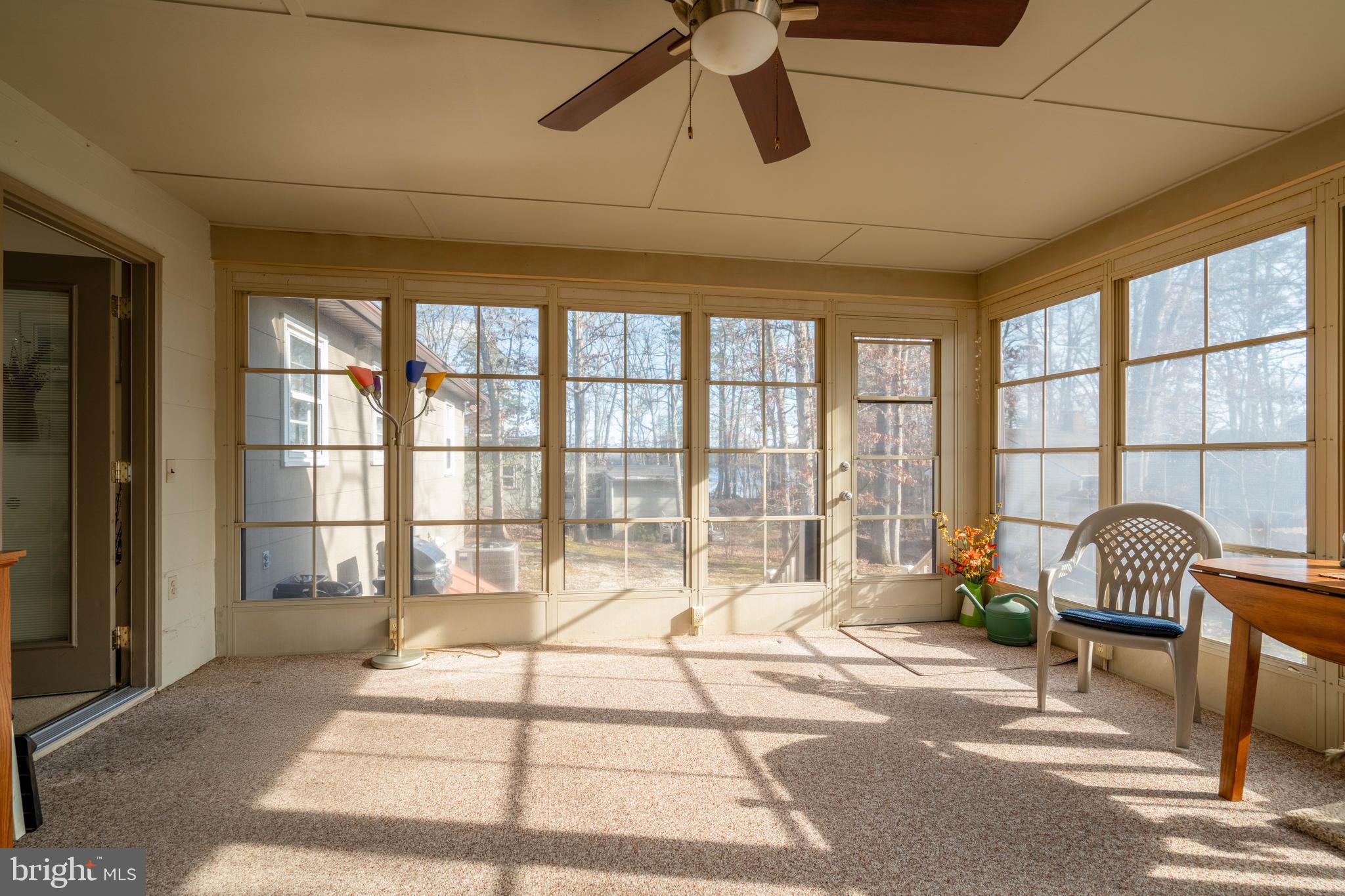 701 Uranus Road Millville, NJ 08332 - Photo 20 of 29 a room with a balcony a bed and a large window