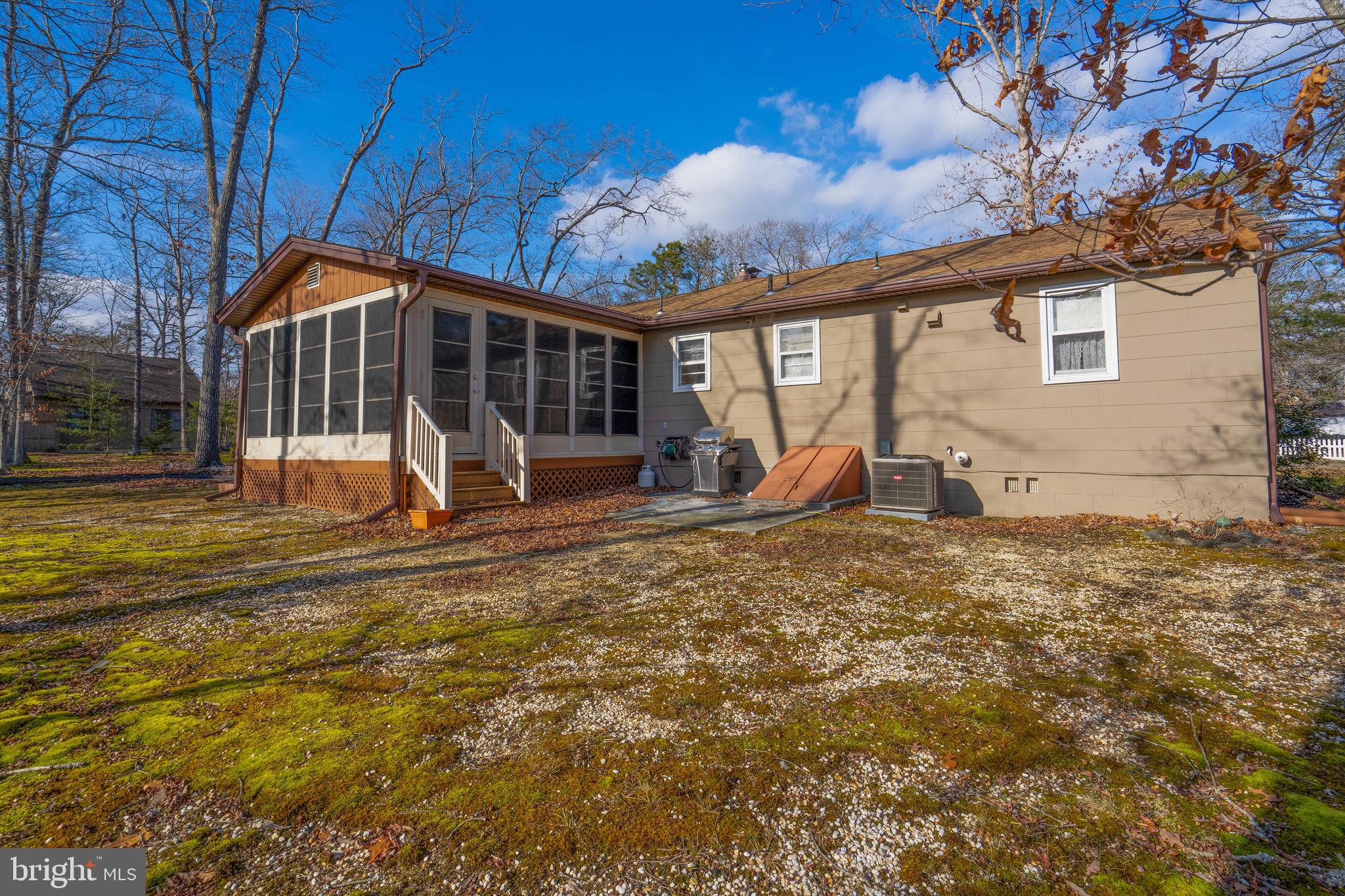 701 Uranus Road Millville, NJ 08332 - Photo 23 of 29 a view of a house with backyard and a tree