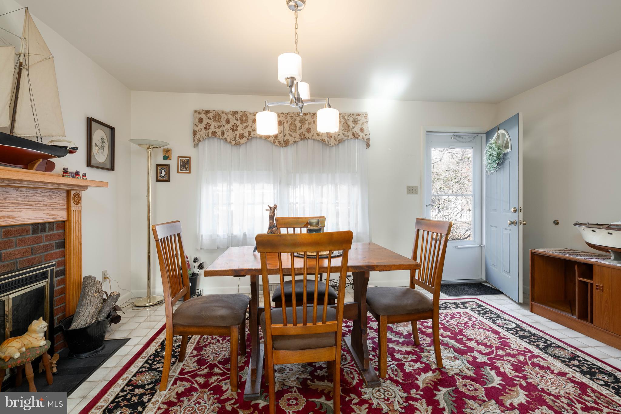 701 Uranus Road Millville, NJ 08332 - Photo 4 of 29 a dining room with furniture a chandelier and wooden floor