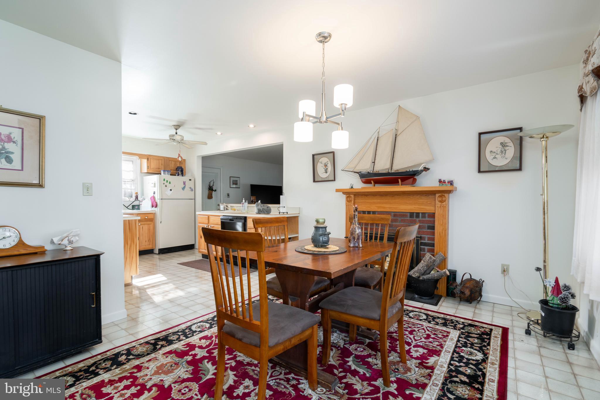 701 Uranus Road Millville, NJ 08332 - Photo 5 of 29 a view of a dining room with furniture and a chandelier