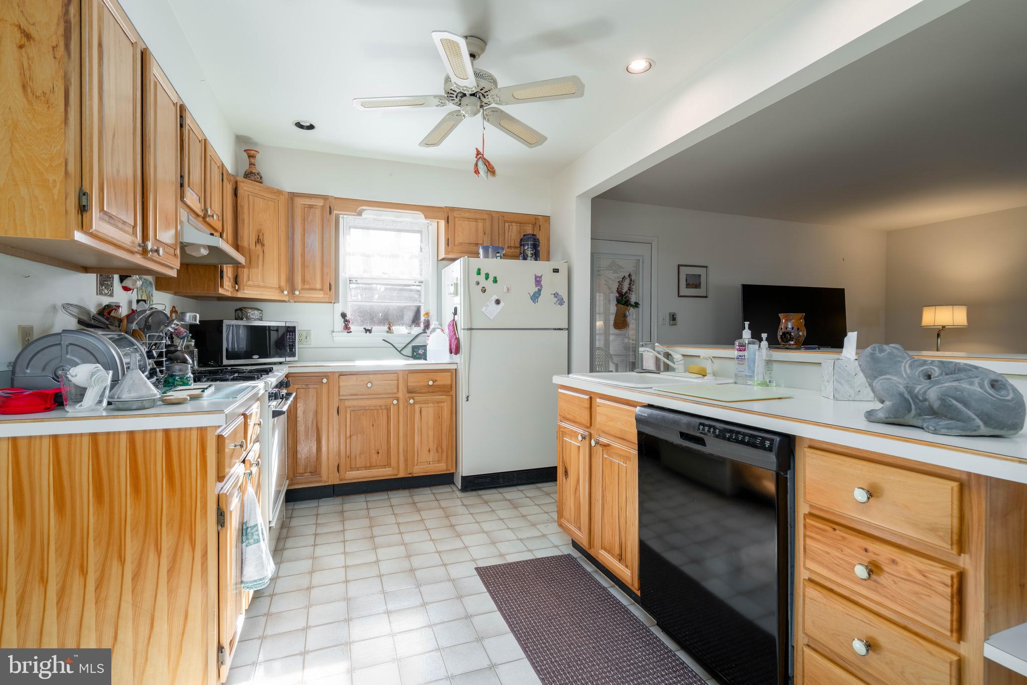701 Uranus Road Millville, NJ 08332 - Photo 6 of 29 a kitchen with stainless steel appliances granite countertop a sink a stove top oven a counter space and cabinets