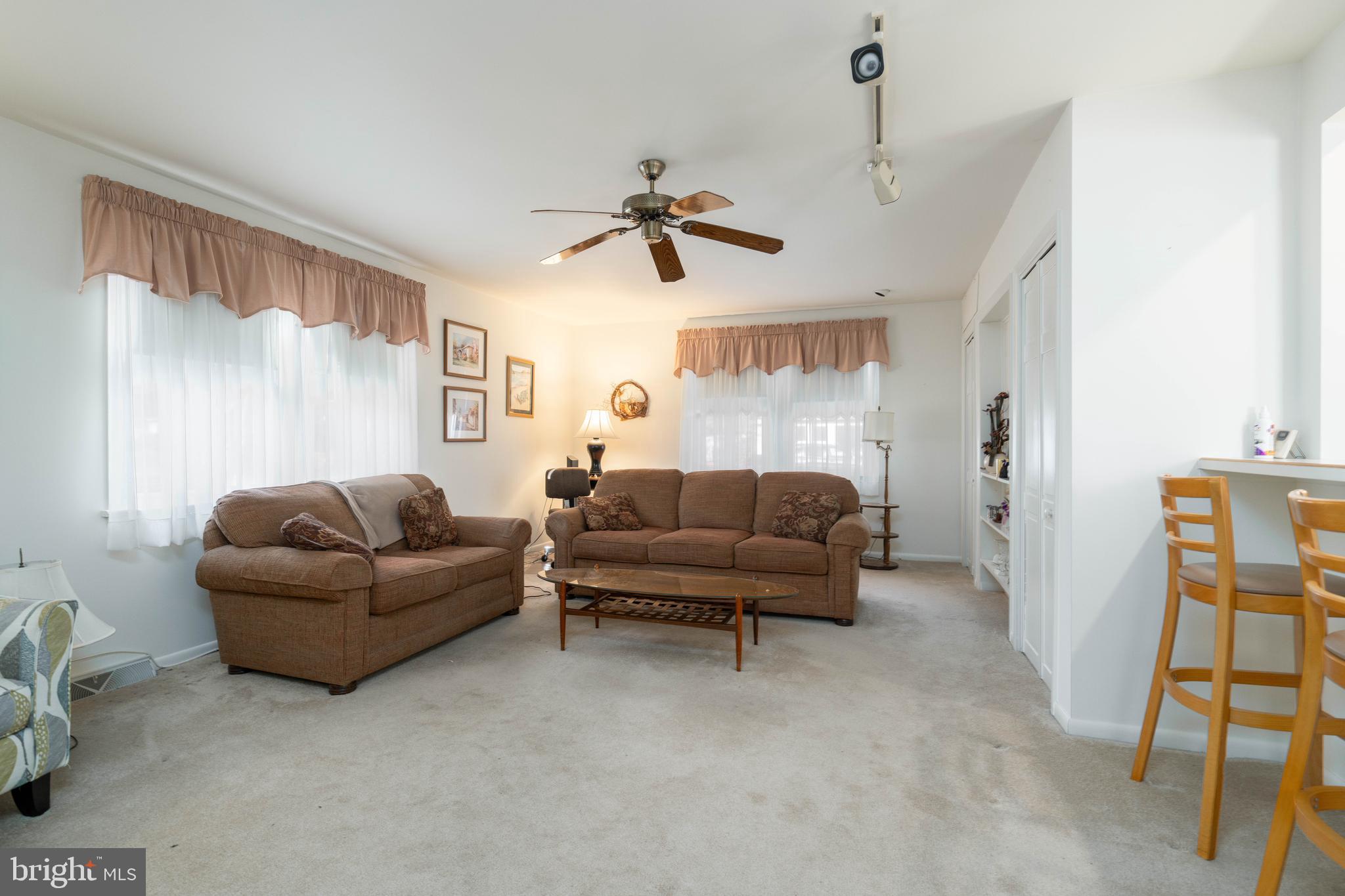 701 Uranus Road Millville, NJ 08332 - Photo 9 of 29 a living room with furniture and a ceiling fan