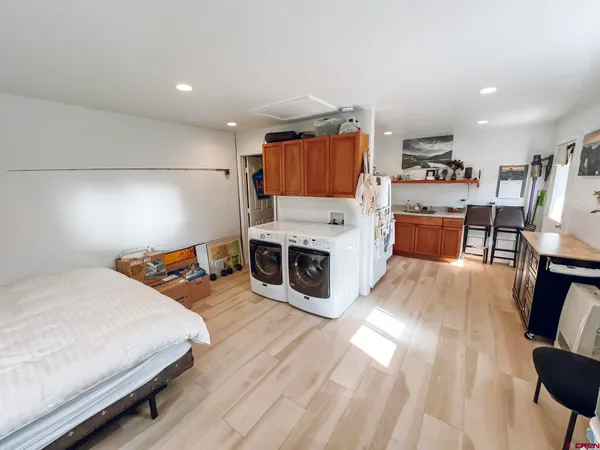 a bedroom with a bed and a tv