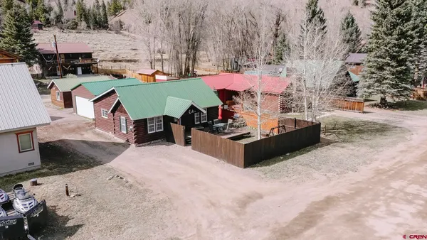 an aerial view of a house with outdoor space