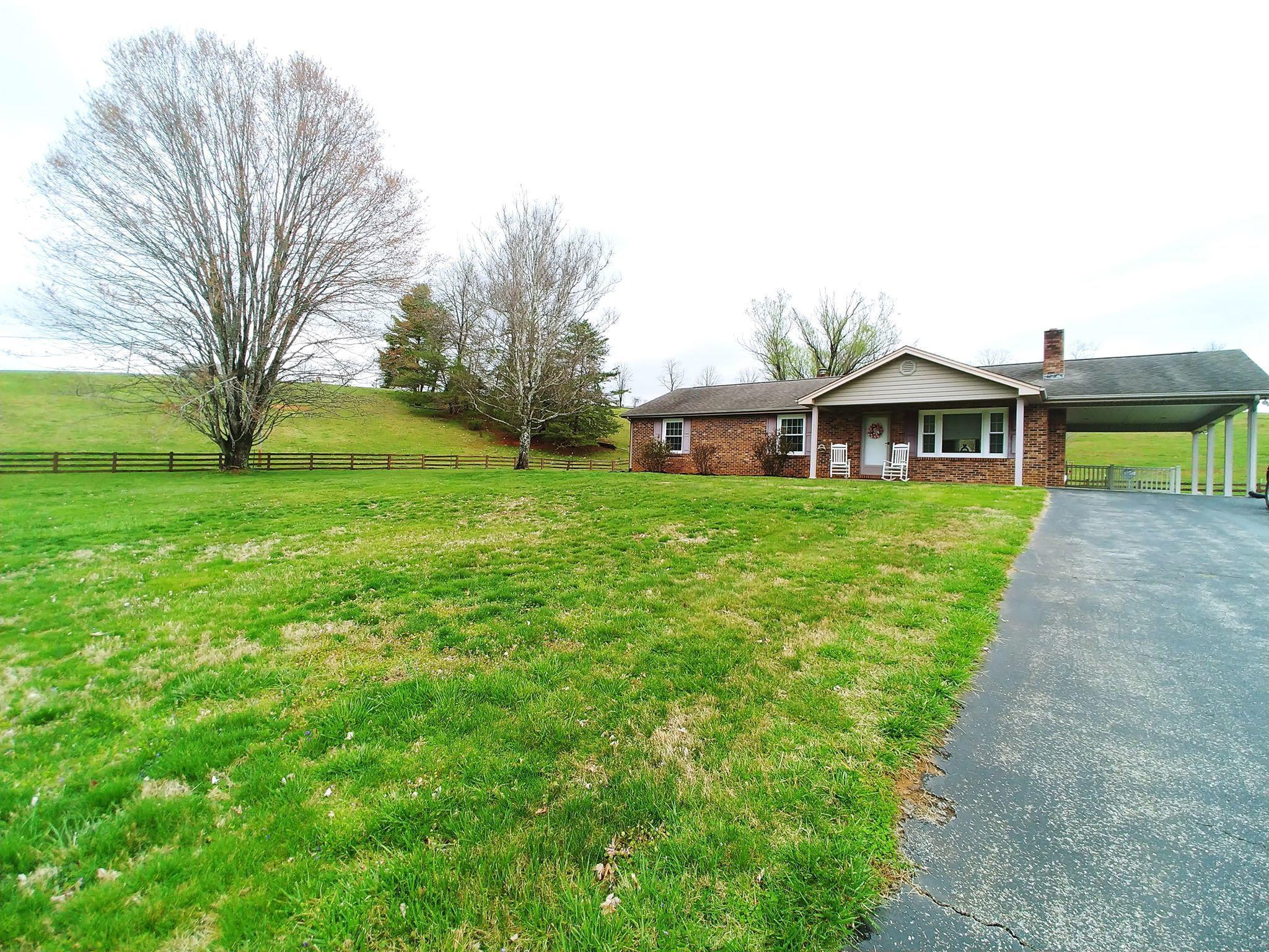 461 Old Forge Road Callaway, VA 24067 - Photo 4 of 29 a view of a house with a big yard and large trees