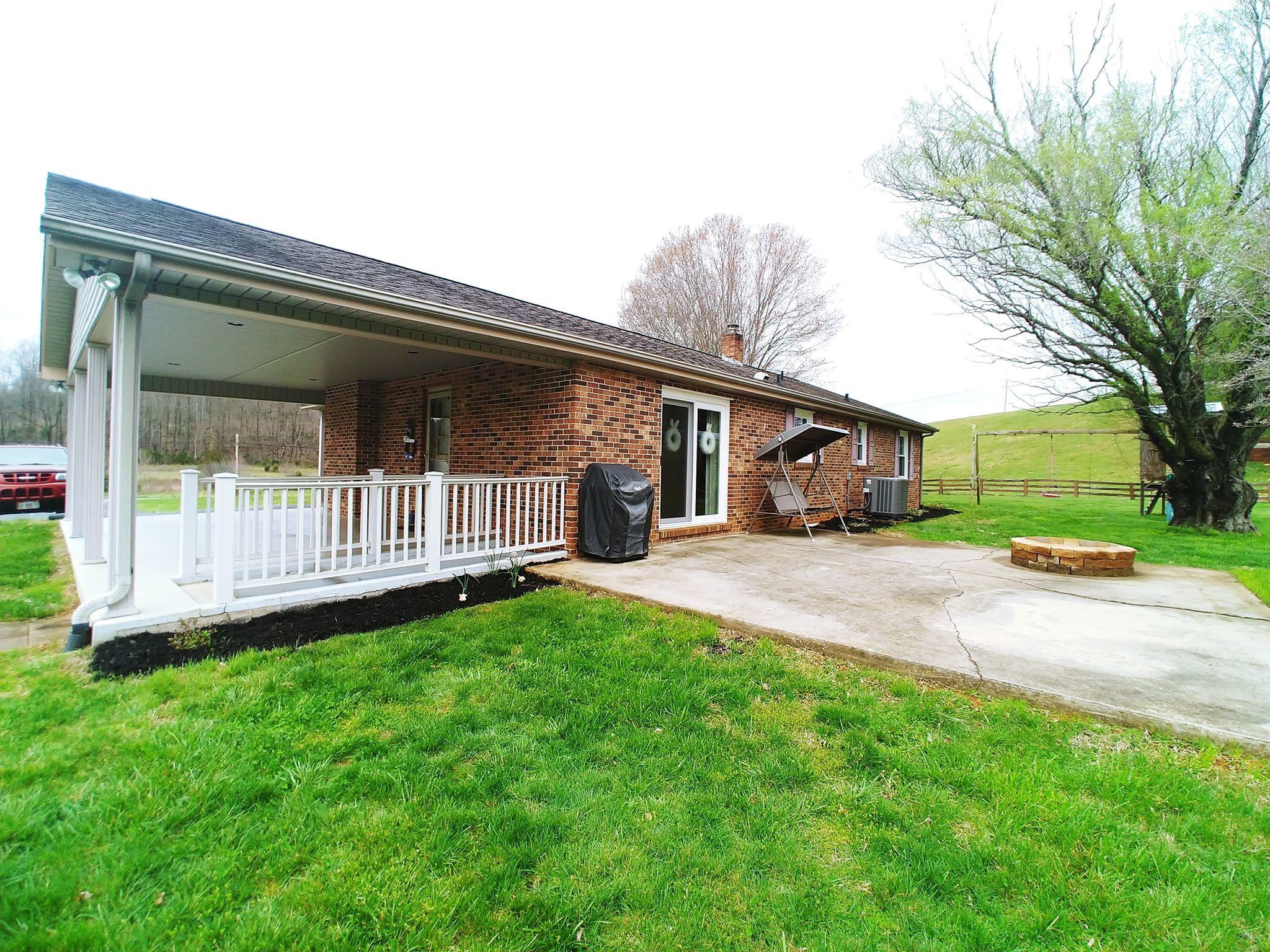 461 Old Forge Road Callaway, VA 24067 - Photo 5 of 29 a front view of a house with a yard and porch