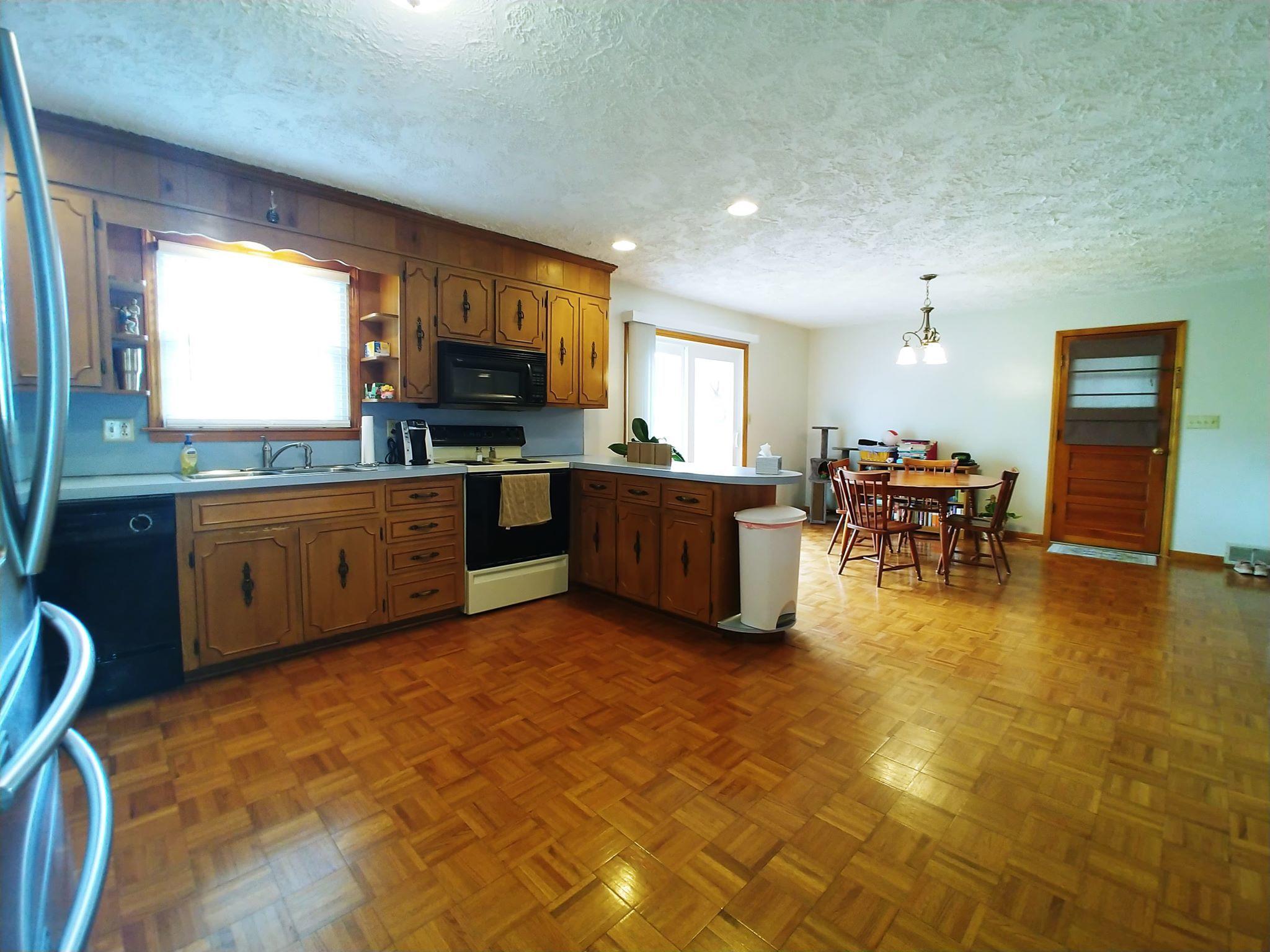 461 Old Forge Road Callaway, VA 24067 - Photo 9 of 29 a view of a kitchen with kitchen island wooden cabinets and stainless steel appliances