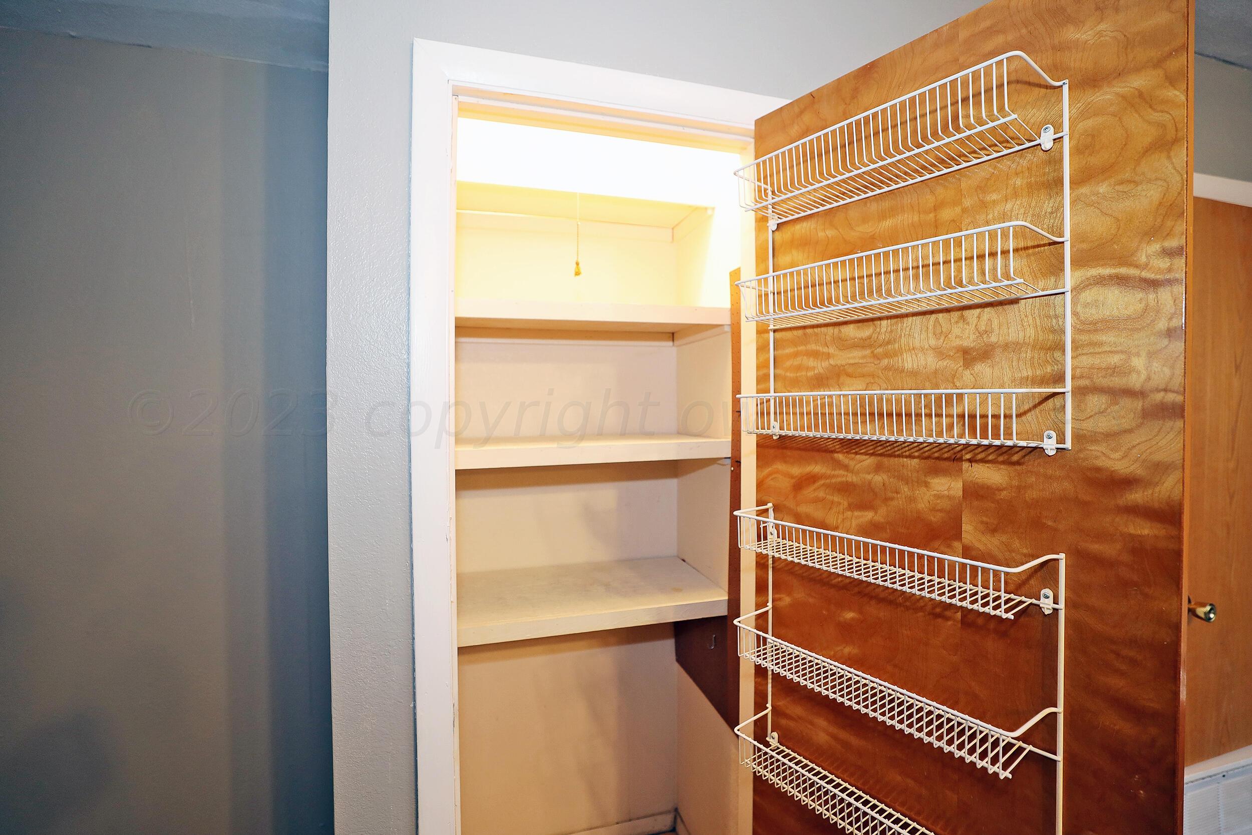 3820 Beaver Drive Amarillo, TX 79107 - Photo 8 of 25 a view of walk in closet with empty racks