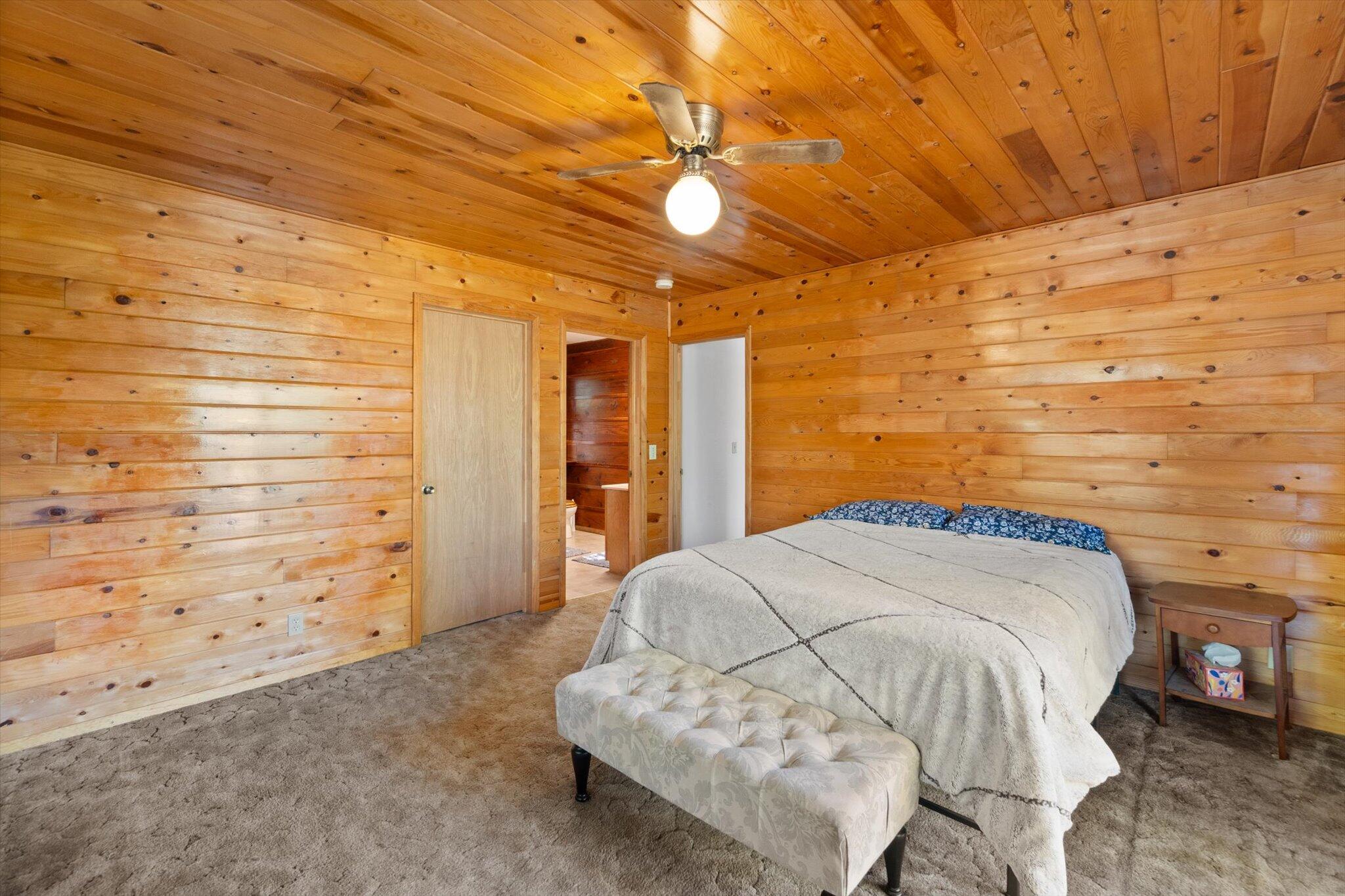 28449 Whippoorwill Circle Shingletown, CA 96088 - Photo 13 of 47 a bedroom with a bed and a ceiling fan