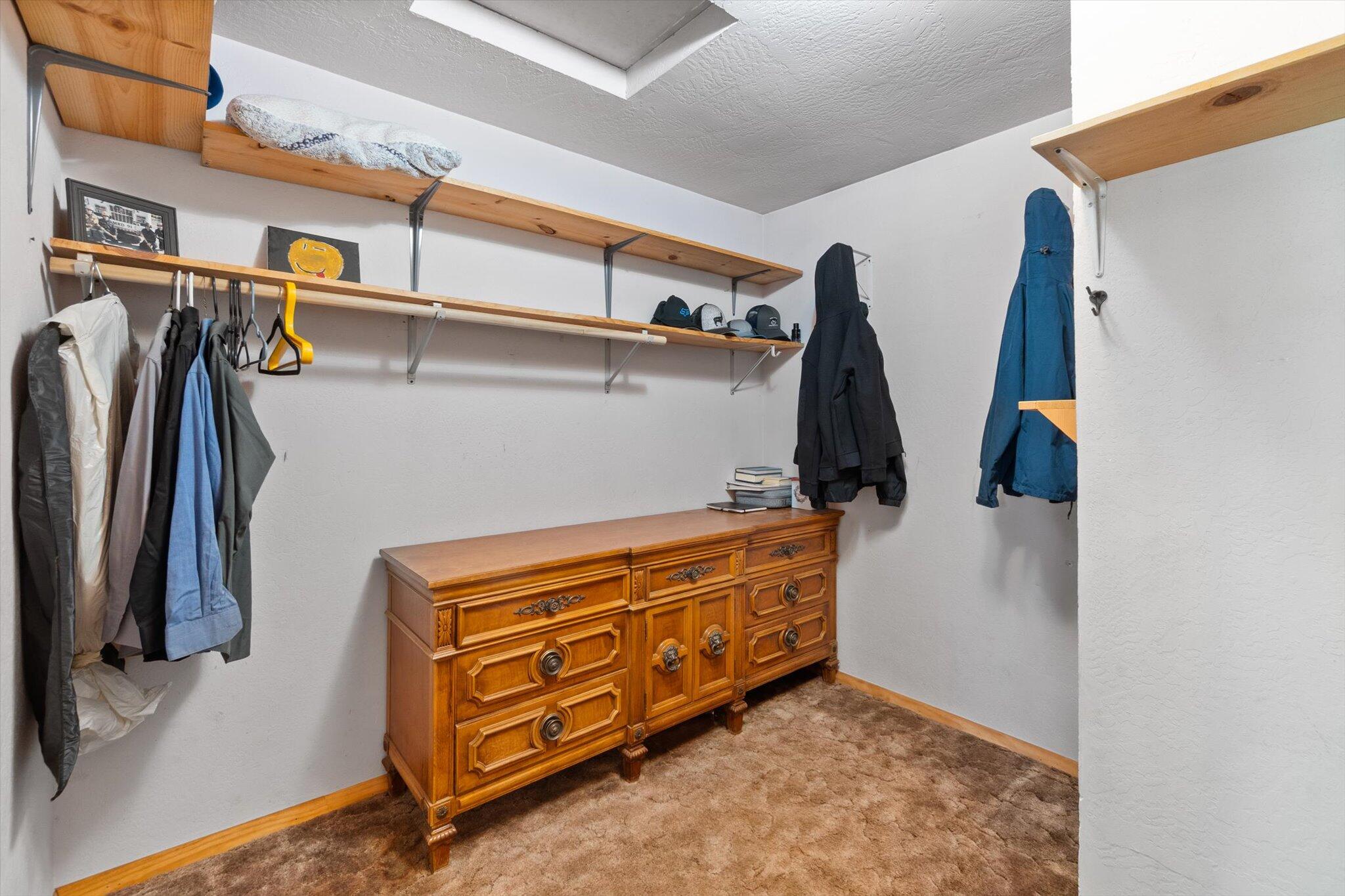 28449 Whippoorwill Circle Shingletown, CA 96088 - Photo 16 of 47 a view of walk in closet with clothes and shoes
