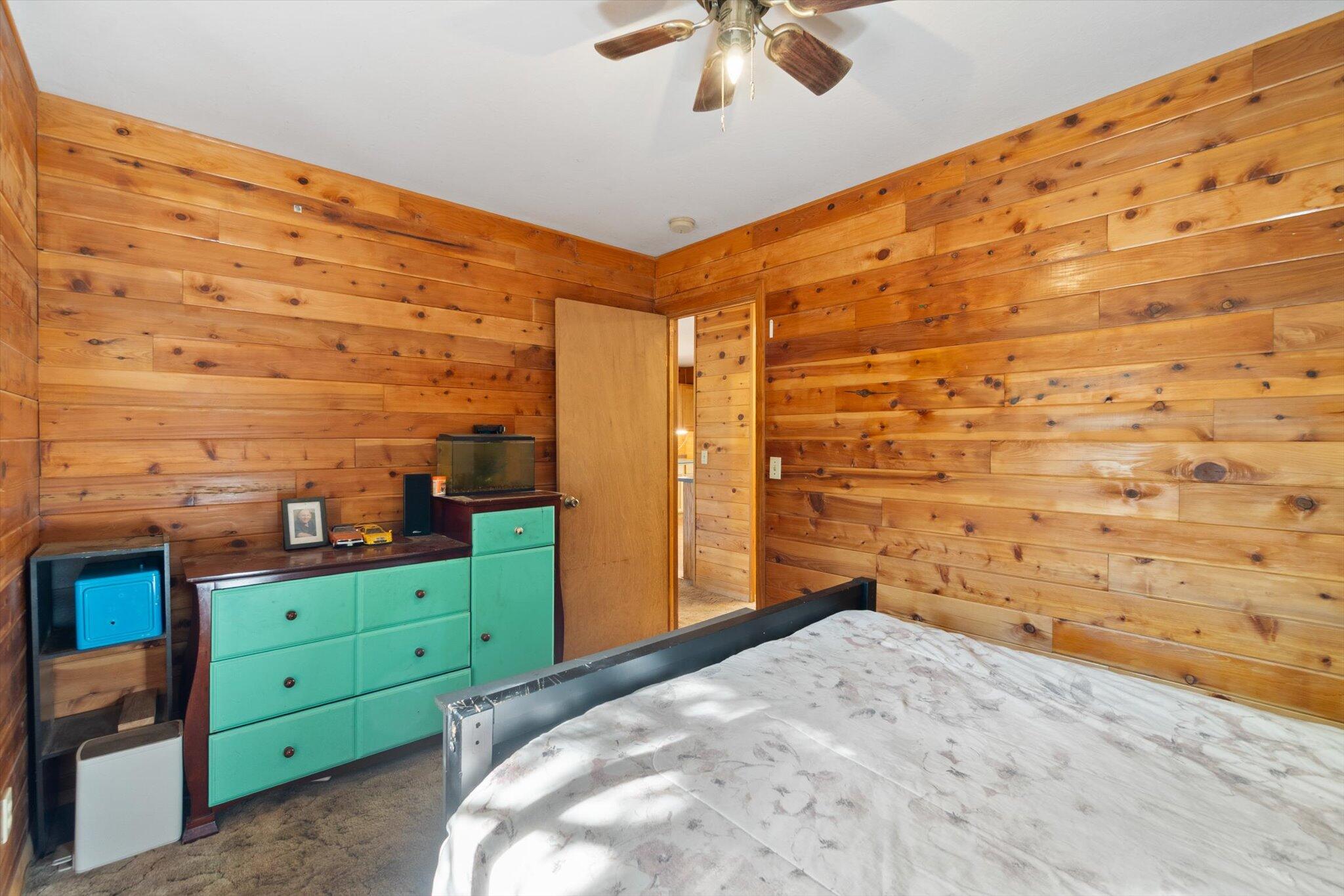 28449 Whippoorwill Circle Shingletown, CA 96088 - Photo 18 of 47 a view of a bedroom with a bed and a cabinet