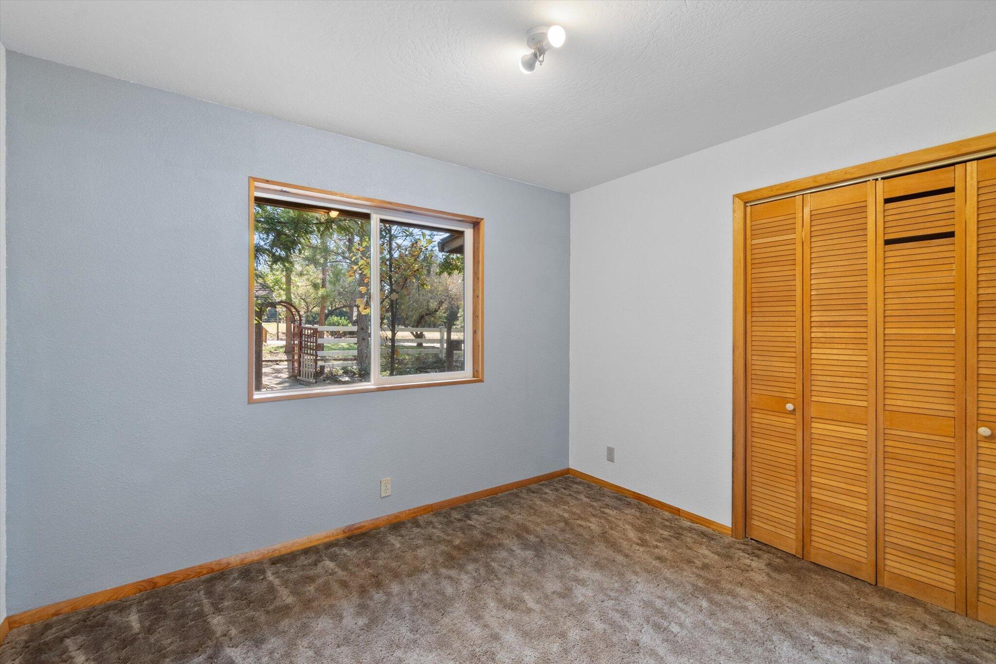 28449 Whippoorwill Circle Shingletown, CA 96088 - Photo 19 of 47 a view of an empty room with a window