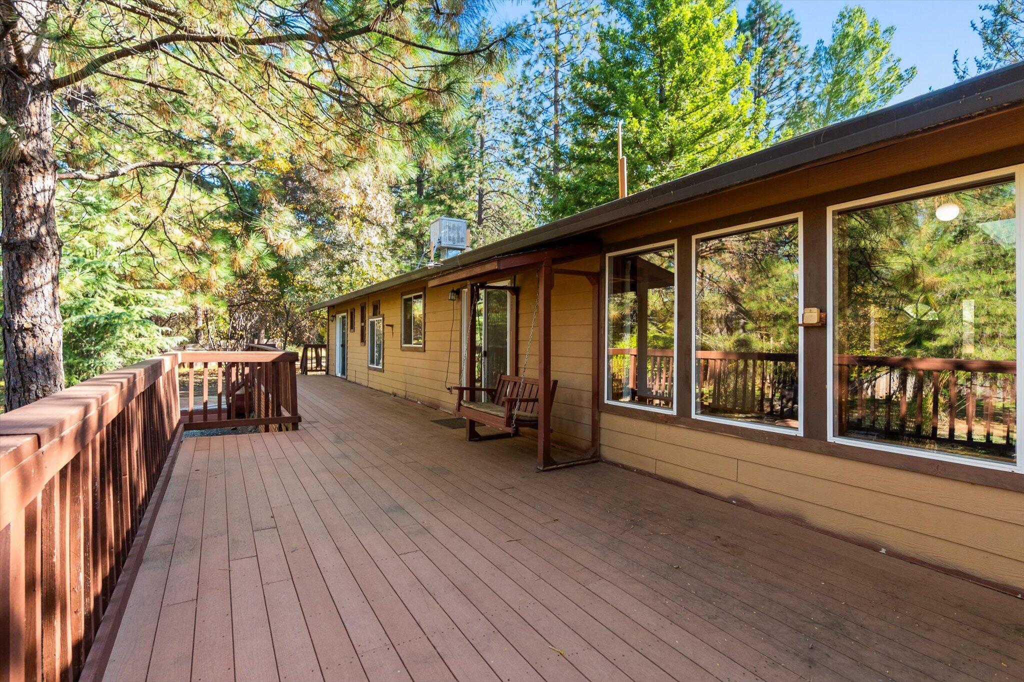 28449 Whippoorwill Circle Shingletown, CA 96088 - Photo 25 of 47 a view of a house with porch and wooden floor