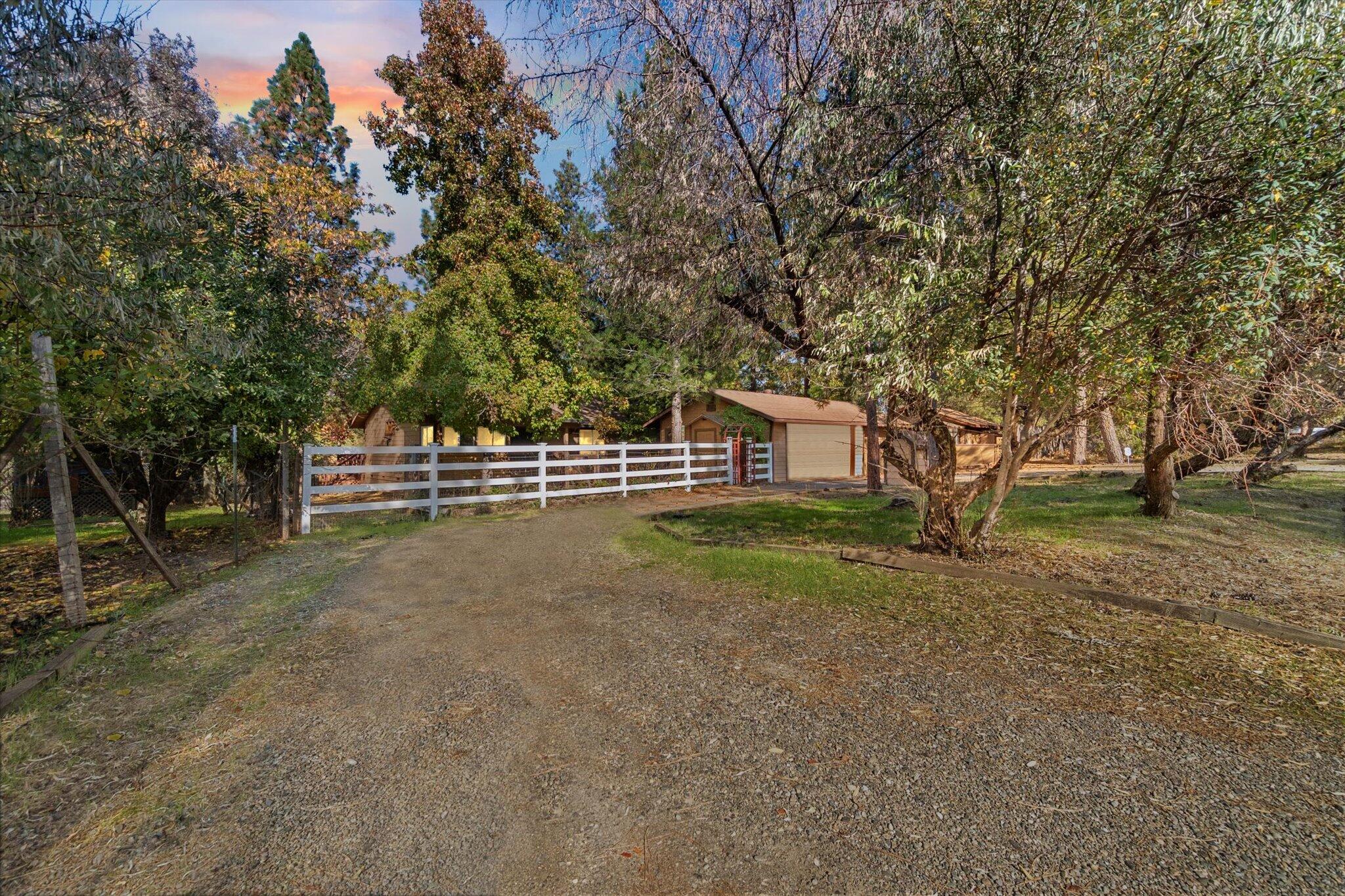 28449 Whippoorwill Circle Shingletown, CA 96088 - Photo 3 of 47 a view of a house with a yard