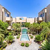 a living room with furniture a fireplace and a window