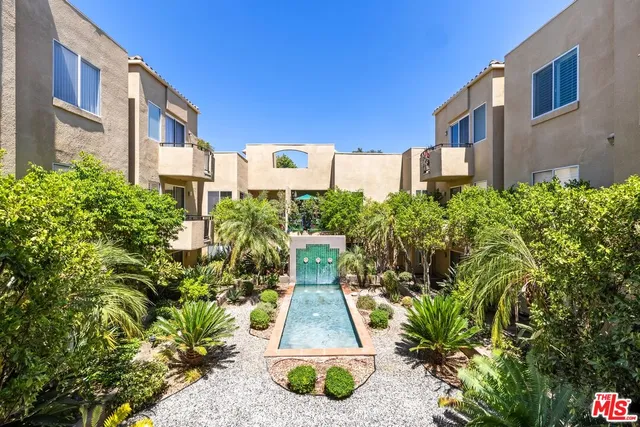 a living room with furniture a fireplace and a window