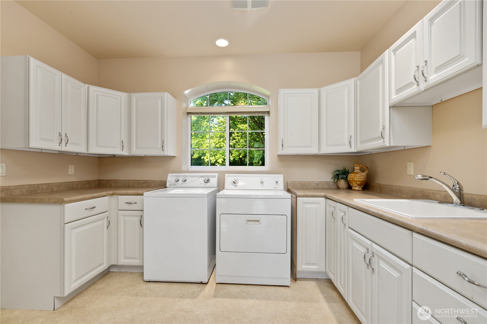 1788 Matz Road Ferndale, WA 98248 - Photo 17 of 40 a kitchen with cabinets appliances a sink and a window