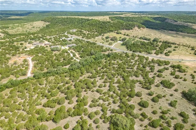 a view of a field with an ocean view
