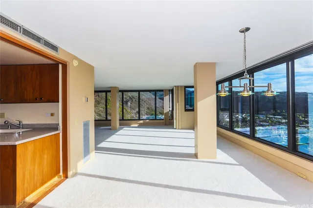 a view of an entryway and hall with wooden floor