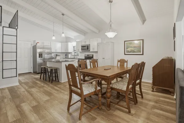 a view of a dining room with furniture