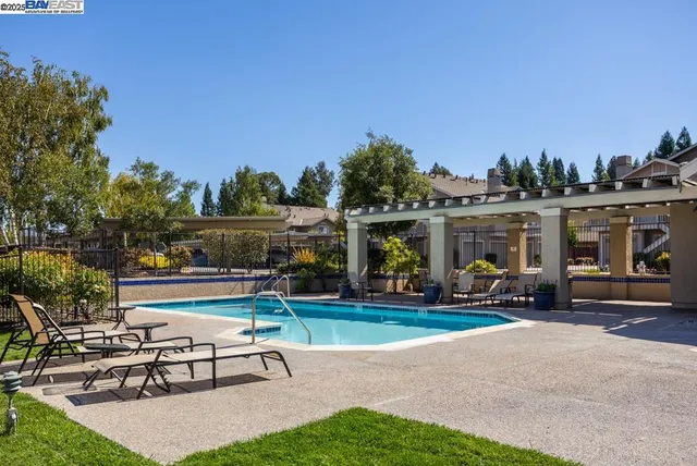 a house view with a sitting space garden and outdoor seating