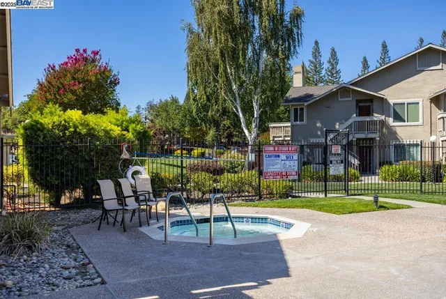 a view of a chairs and tables in the park