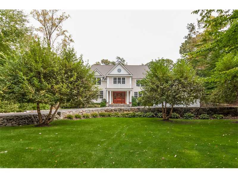 46 Stony Brook Road Darien, CT 06820 - Photo 20 of 24 a front view of a house with a garden