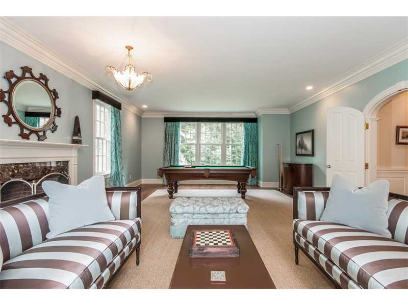 46 Stony Brook Road Darien, CT 06820 - Photo 4 of 24 a living room with furniture and a fireplace