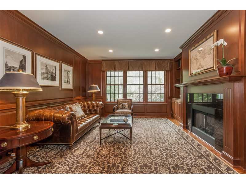 46 Stony Brook Road Darien, CT 06820 - Photo 6 of 24 a living room with furniture a fireplace and a flat screen tv