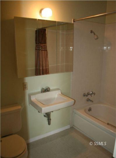 404 Karin Street Ridgecrest, CA 93555 - Photo 4 of 10 a bathroom with a sink and a toilet