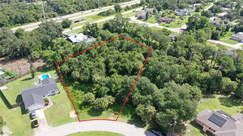 284 Hinton Street Port Charlotte, FL 33954 - Photo 1 of 16 an aerial view of residential house with outdoor space and trees all around