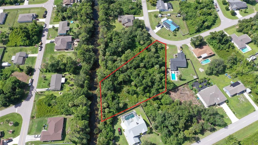 284 Hinton Street Port Charlotte, FL 33954 - Photo 12 of 16 an aerial view of residential house with outdoor space and swimming pool