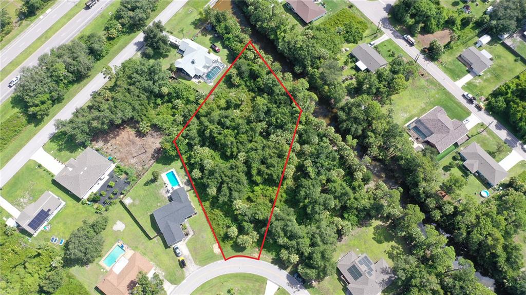 284 Hinton Street Port Charlotte, FL 33954 - Photo 13 of 16 an aerial view of a house with a yard