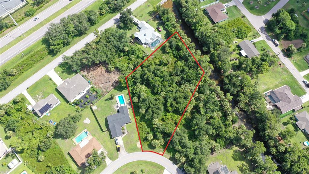 284 Hinton Street Port Charlotte, FL 33954 - Photo 16 of 16 an aerial view of residential houses with yard