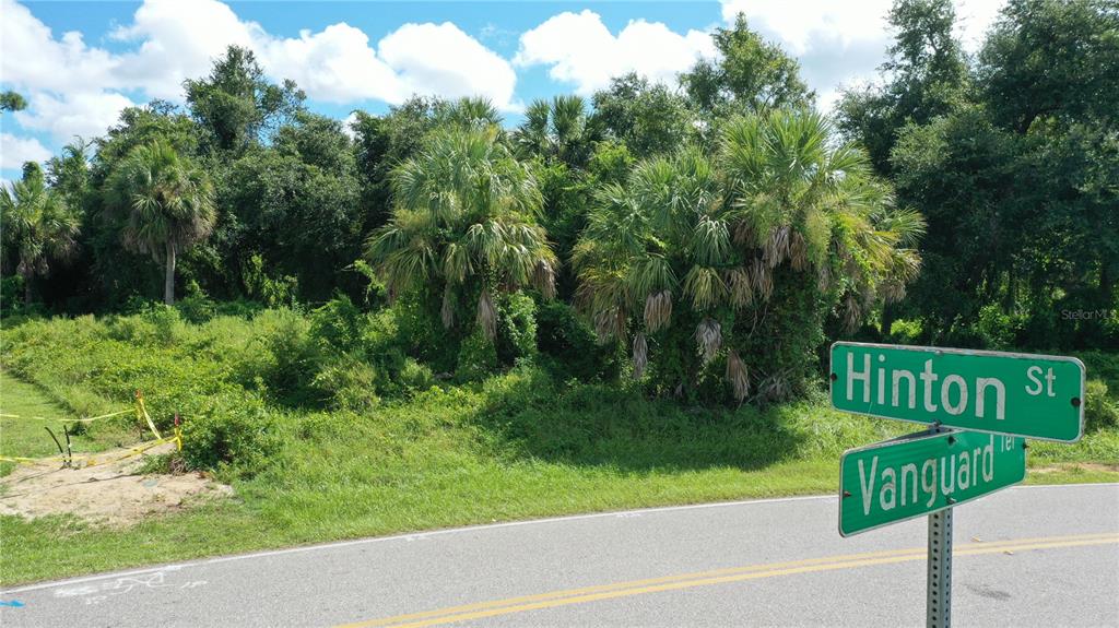 284 Hinton Street Port Charlotte, FL 33954 - Photo 2 of 16 a view of a street with a bench and trees around