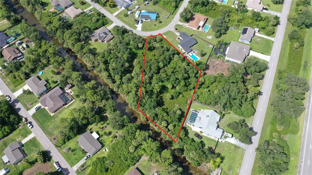 284 Hinton Street Port Charlotte, FL 33954 - Photo 6 of 16 an aerial view of residential houses with outdoor space and trees