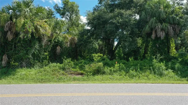 a view of a yard from a balcony