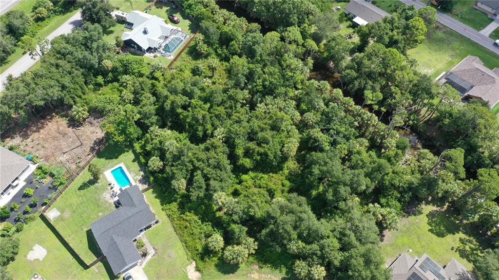 284 Hinton Street Port Charlotte, FL 33954 - Photo 10 of 16 an aerial view of residential house with outdoor space and trees all around