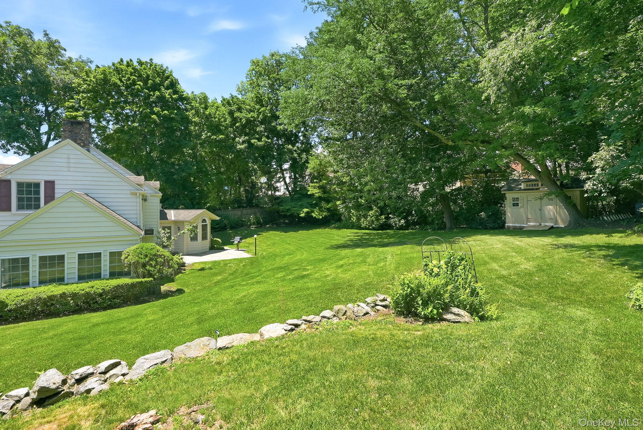 1 Sheridan Road Scarsdale, NY 10583 - Photo 36 of 40 Looking towards the house from above the stone garden wall