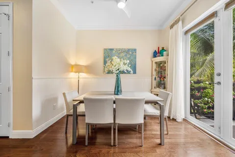 a view of a dining room with furniture and wooden floor